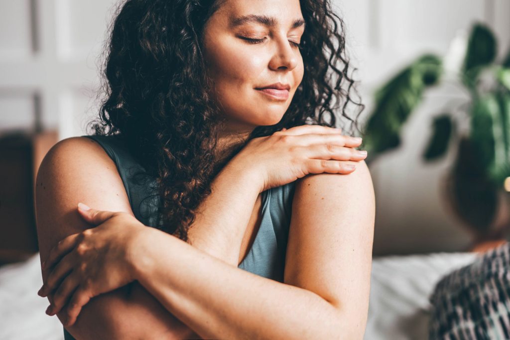 Woman with curly hair relaxed.