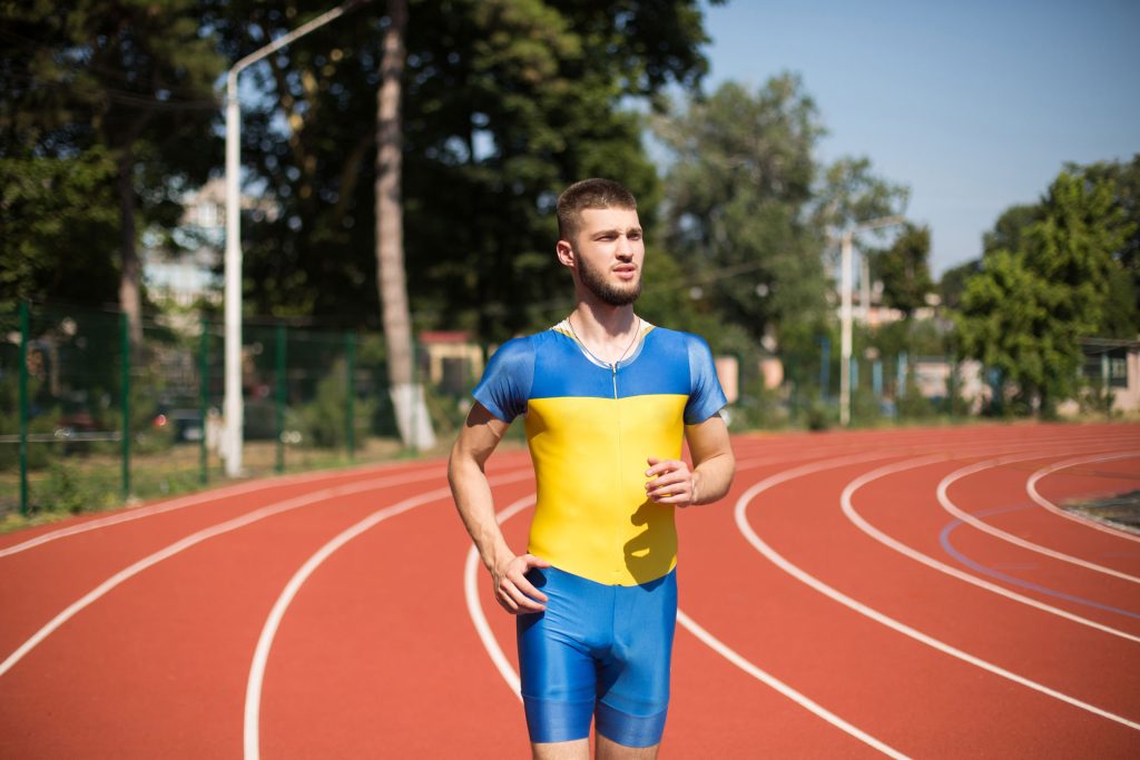 Young athlete running on track.