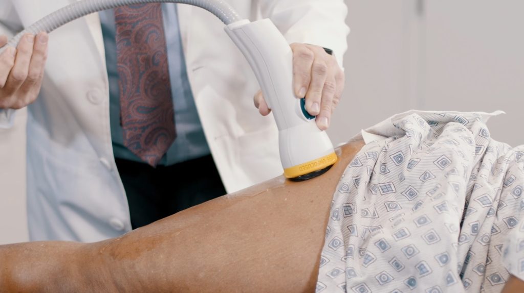 Softwave therapy on back.